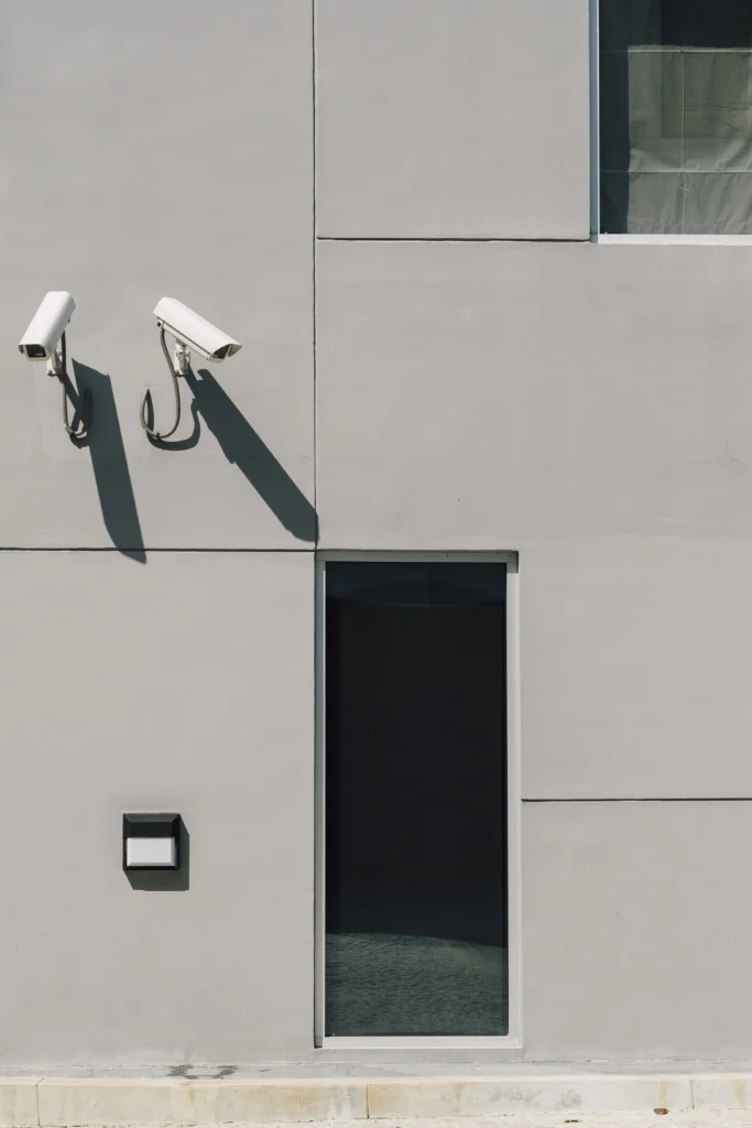 Outdoor CCTV cameras installed on a modern building wall by Hami Technologies – expert CCTV services in Kerala.